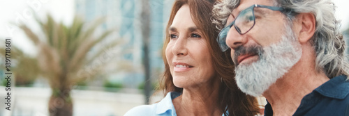 Wallpaper Mural Close-up of an elderly couple standing on the embankment and looking at each other with smile. Panoramic Torontodigital.ca