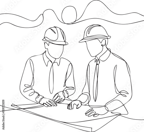 Two men in hard hats discussing a blueprint outdoors during sunset