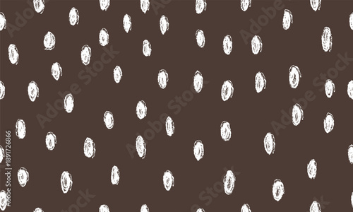 Fawn deer skin with white spots. Simple animal texture. Wild animal dark brown spotted background.