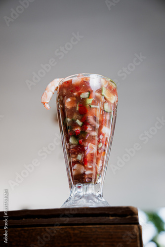 Mexican Shrimp Cocktail in Traditional Glass with Lime and Cilantro