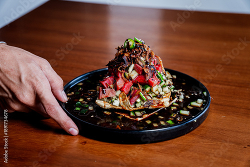 Gourmet Seafood Tostada with Fresh Shrimp and Avocado on a table