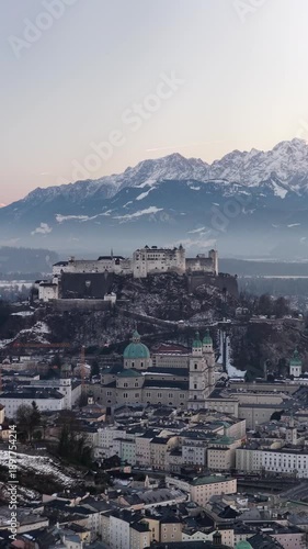 Salzburg vertical video Austria castle with snowy mountains sunset