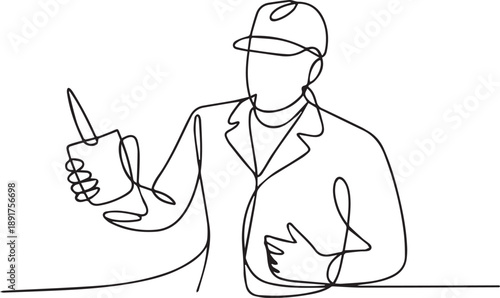 Man in cap gesturing with stylus and tablet