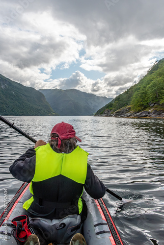 Wallpaper Mural A young woman paddling in a kayak in the Arnafjord Torontodigital.ca