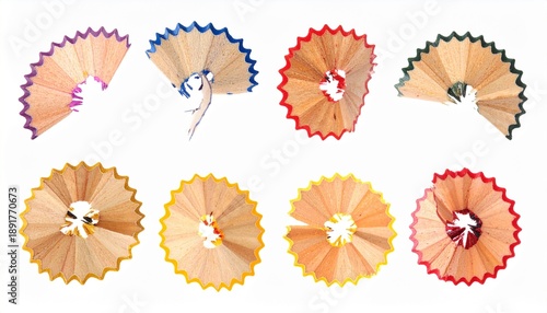 Eight colorful pencil shavings arranged symmetrically, showcasing vibrant edges and natural wood texture.