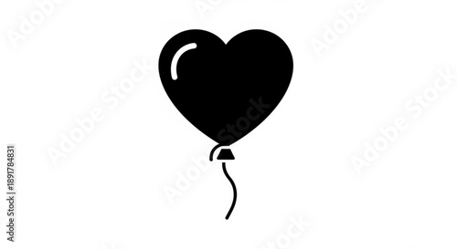Black heart shaped balloon floating alone on white background with shiny surface and tied string