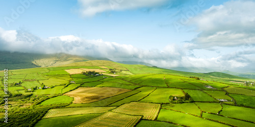 Aerial view of endless lush pastures and farmlands of Ireland's