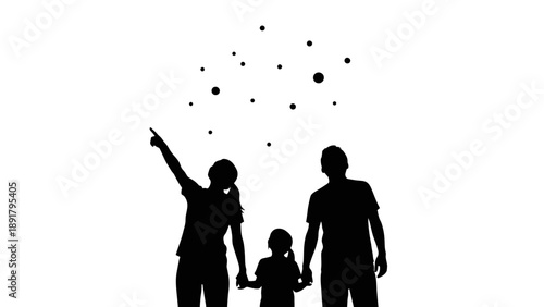 Silhouette of a happy family with a child pointing upwards together.