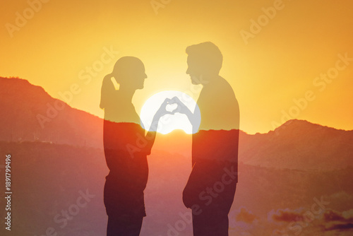 Couple Forming Heart Shape at Sunset, Valentines Day love concept 
