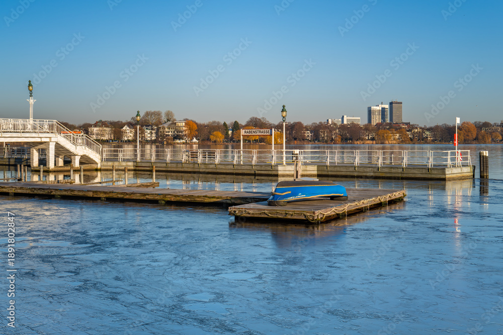 Fototapeta premium Hamburg, Germany. The frozen lake Alster in winter with pier.