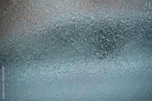 An icy windshield photographed from inside a car