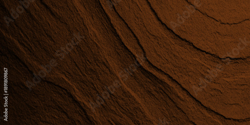 Aged dark brown oak timber board with a rough natural grain pattern creates a vintage grunge wood texture background on an old weathered surface