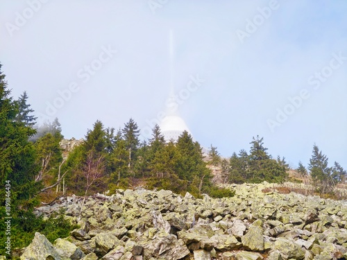 Sunrise illuminating rugged mountain slopes, Solitary mountain peak with majestic natural landscape