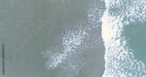 Wallpaper Mural Aerial top down view of grey ocean waves on sand The Concept of Melancholy Torontodigital.ca