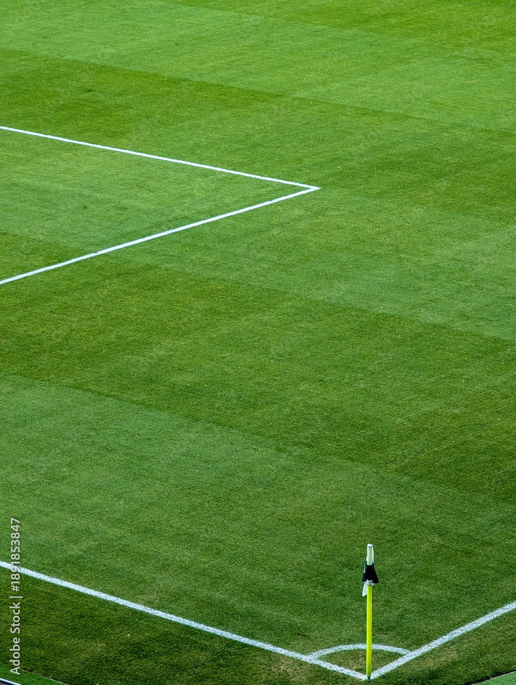 Fototapeta premium Soccer Field Corner Flag On Green Grass With White Boundary Lines