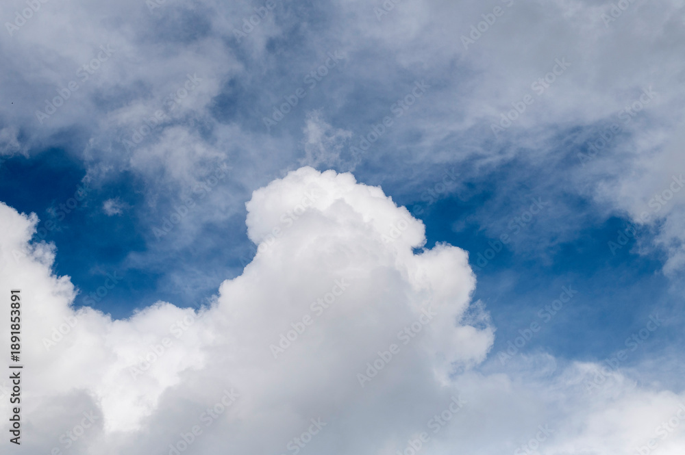 Obraz premium Bright White Cloudscape Against Deep Blue Sky With Fluffy Clouds and Soft Light