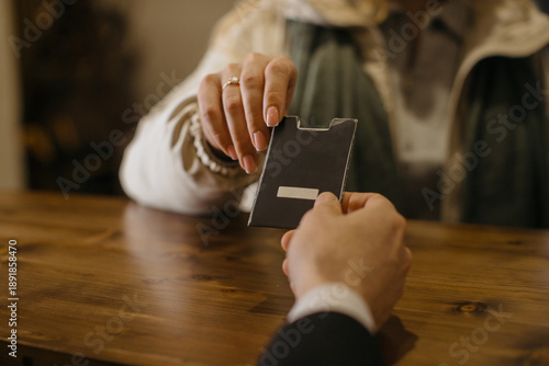 Canvas Print Hotel guest checking in receiving key card