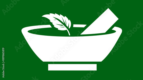 A white mortar and pestle with a leaf inside on a green background