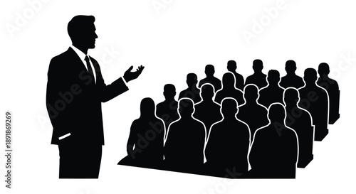 A speaker addressing an audience in a striking black silhouette