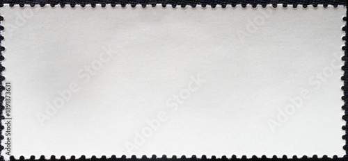 Foto Empty back side of a vintage post stamp on black