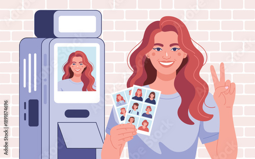 Woman holding passport photos and making a peace sign beside a photo booth