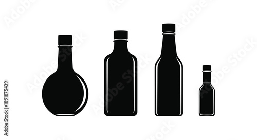 Four black bottle shapes arranged in a row a striking silhouette