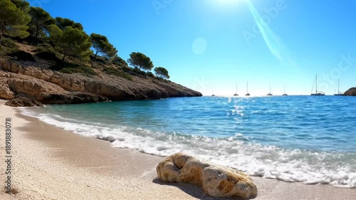 Scenic coastal beach scene on a sunny day with clear turquoise water, white sand, and sailboats in the distance