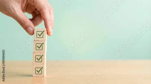 Wallpaper Mural hand placing wooden blocks with green checkmarks on table Torontodigital.ca