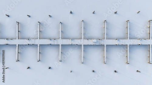 Ithaca, NY, USA. 01-24-2026 Winter aerial photo of frozen, snowy marina, docks at Allan H Treman State Marine Park,