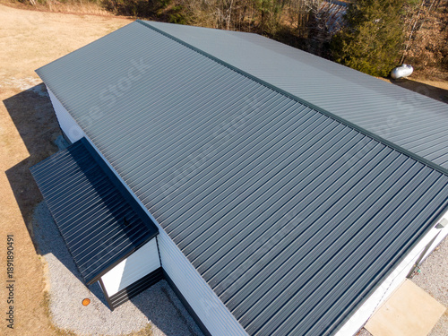 High Resolution Aerial Drone View of Gray Standing Seam Metal Roof On Commercial Building