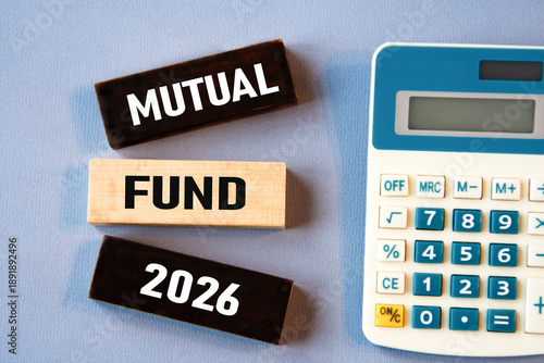 MUTUAL FUND 2026 - words on wooden colored blocks against a calculator background