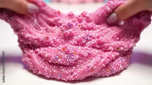 Wallpaper Mural Sensory pink slime with foam beads being stretched and pulled, satisfying and colorful close up Torontodigital.ca