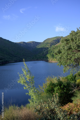 Serene mountain lake with blue sky
