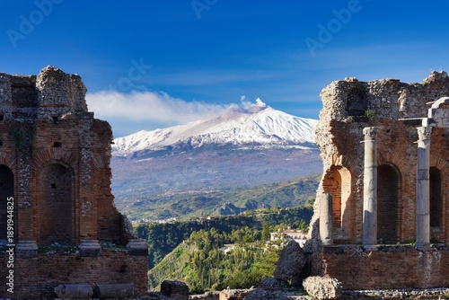 Fotografie View of Mount Etna from the Ancient theatre of Taormina.