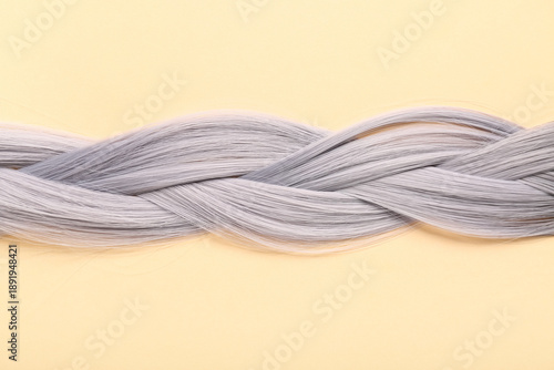 Tableau sur toile Braided grey hair on beige background
