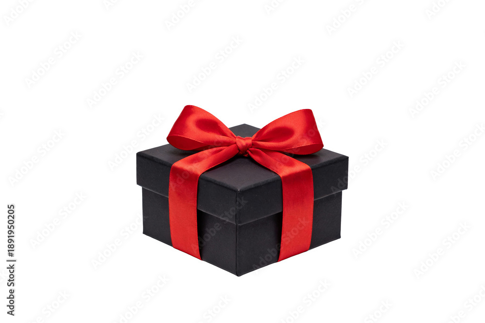 Obraz premium Black rectangular gift box adorned with a glossy red ribbon bow, ideal for festive celebrations or gifting occasions. Simple, elegant design for presents.