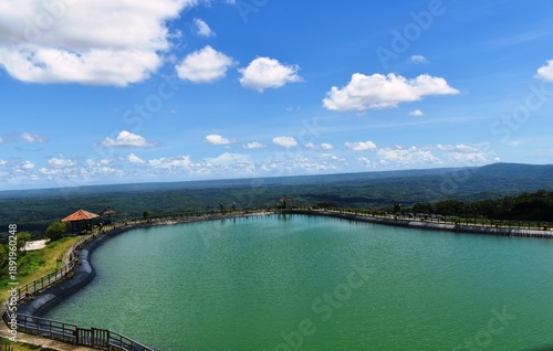 Wallpaper Mural Embung Nglanggeran in Yogyakarta, Indonesia. Artificial reservoir built on a high place as a source of water for local residents. This reservoir is also used as a tourist spot. Torontodigital.ca