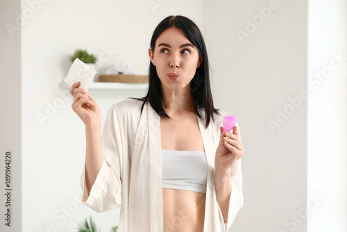 Thoughtful young woman with...