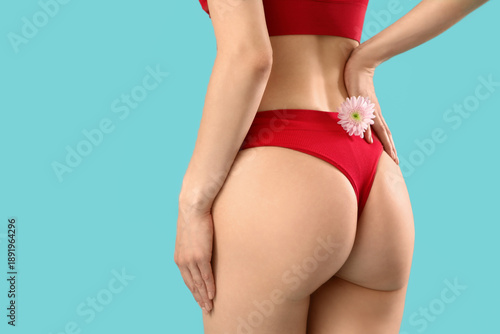 Young woman in panties on b...