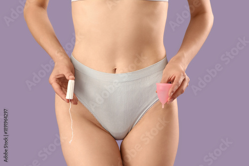Young woman in panties with...