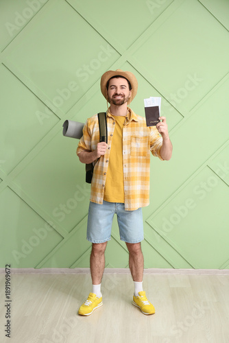 Young male tourist with pas...