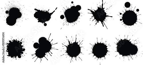 Collection of black ink splatters on white background viewed from directly above