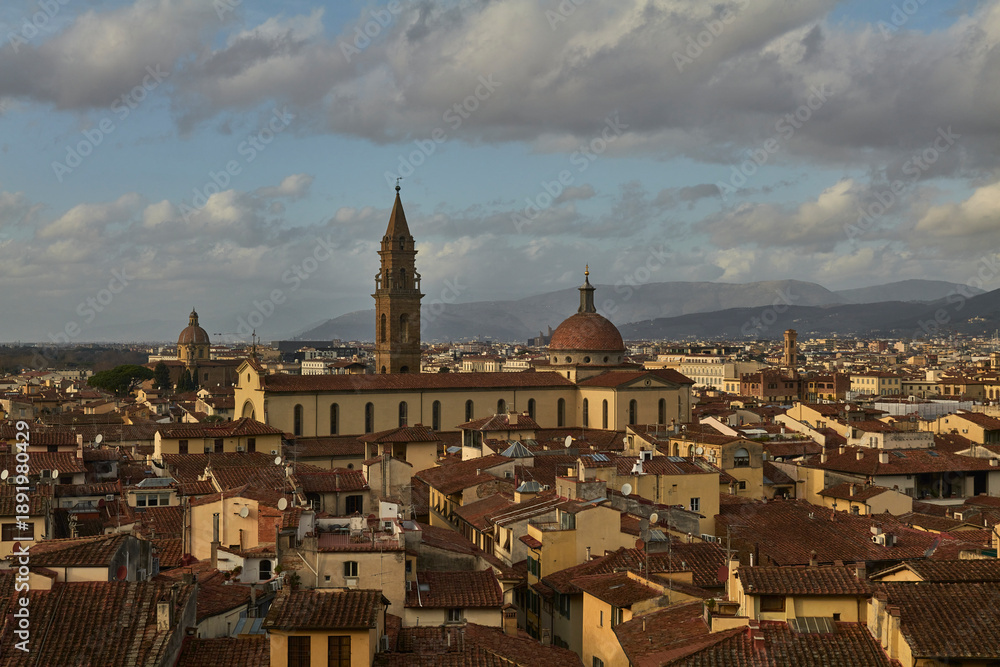 Fototapeta premium Wide Florence Cityscape with Dome and Bell Tower Under Clouds