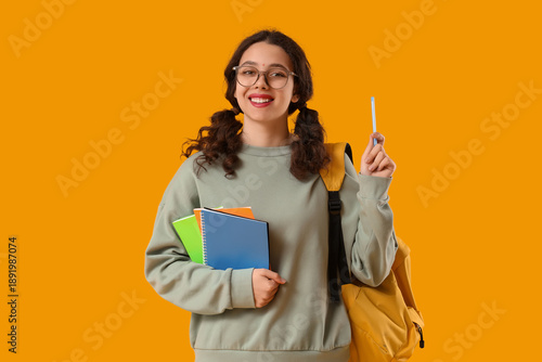 Smiling female student with...