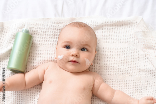 Cute little baby with cream...