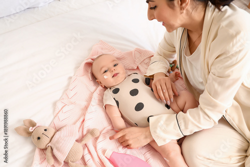 Happy mother and her cute l...