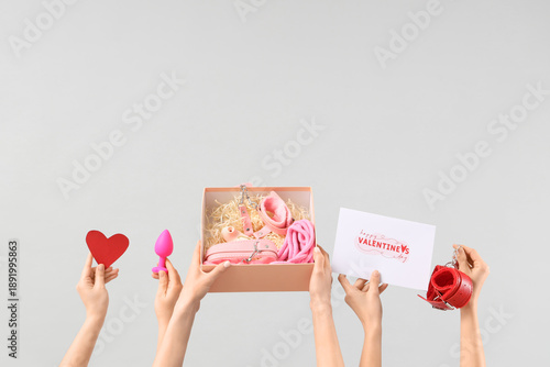Female hands with sex toys,...
