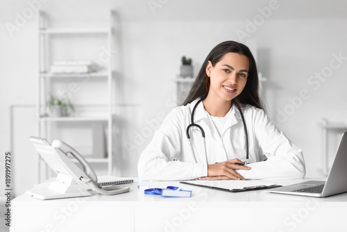 Young female doctor sitting...