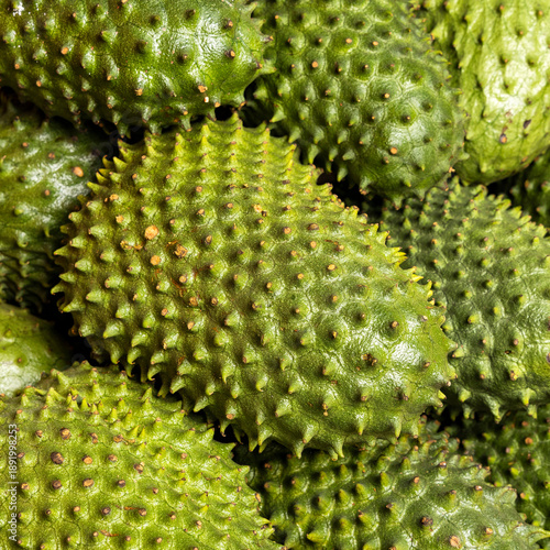 Soursops for sale in a traditional Colombian market, highlighting the color, texture, and freshness of this tropical fruit.