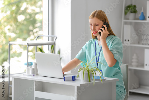 Happy female doctor talking...